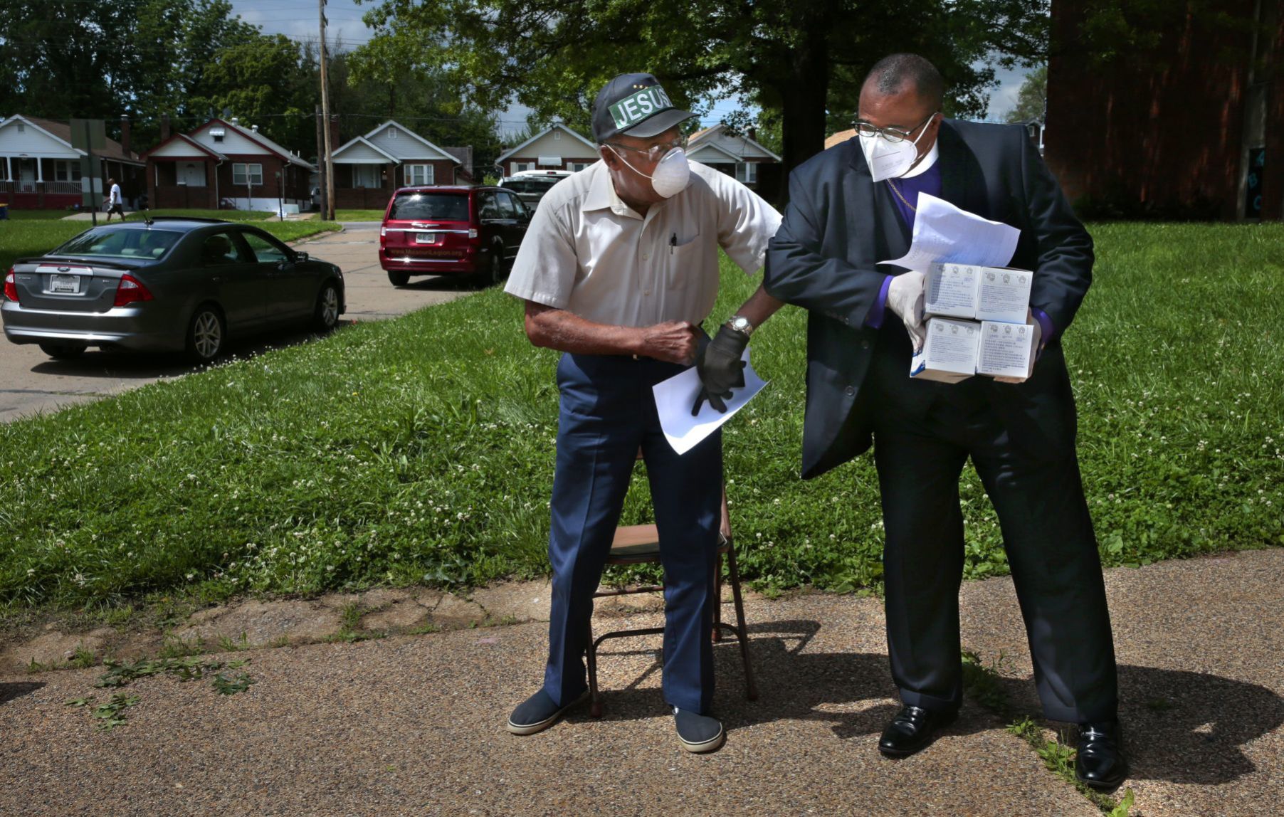 Clergy distributing masks to area churches